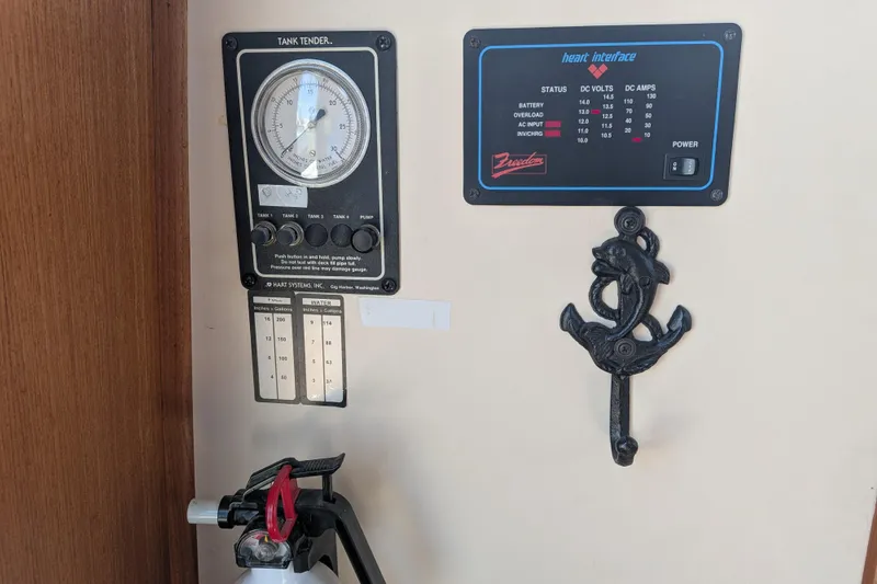 Slide: The Image of Control panel and anchor hook inside a 1998 Nordic Tug 32 boat. - 29