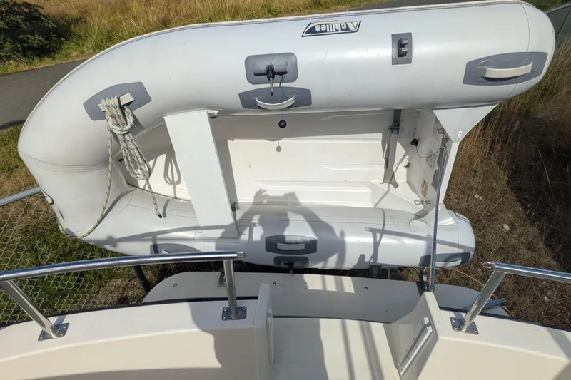 Slide: The Image of Inflatable dinghy mounted on a 1998 Nordic Tug 32 boat, viewed from above. - 9