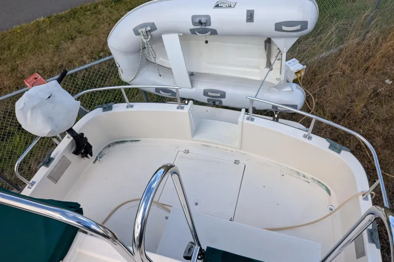 Slide: The Image of 1998 Nordic Tug 32 boat deck with inflatable dinghy and railing. - 10
