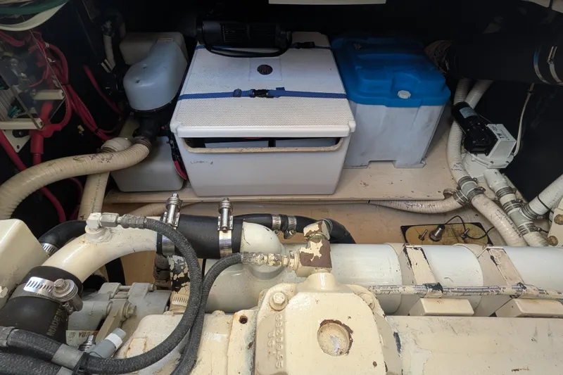 Slide: The Image of Engine room of a 1998 Nordic Tug 32 with visible components and piping. - 39