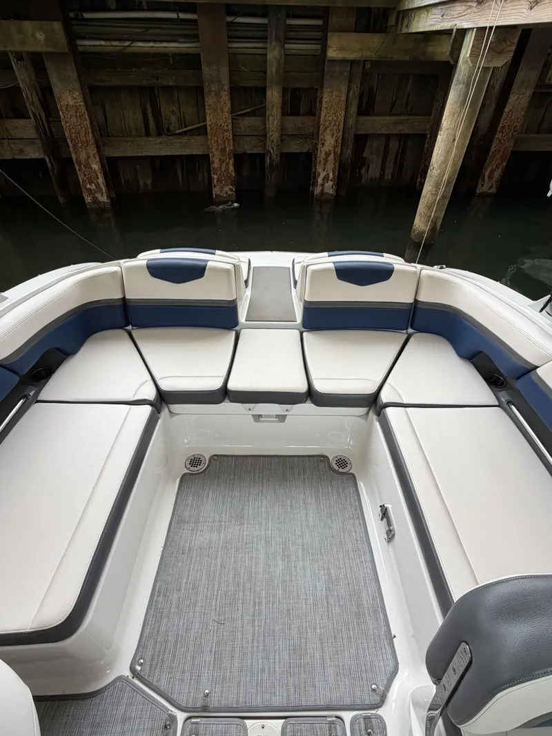 Slide: The Image of The image shows the cockpit of a Chaparral 223 Vortex boat with white and blue seating. - 8