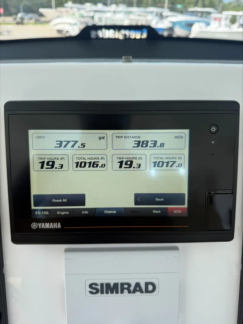 Slide: The Image of Simrad display showing boat data like fuel consumption and trip distance. - 13