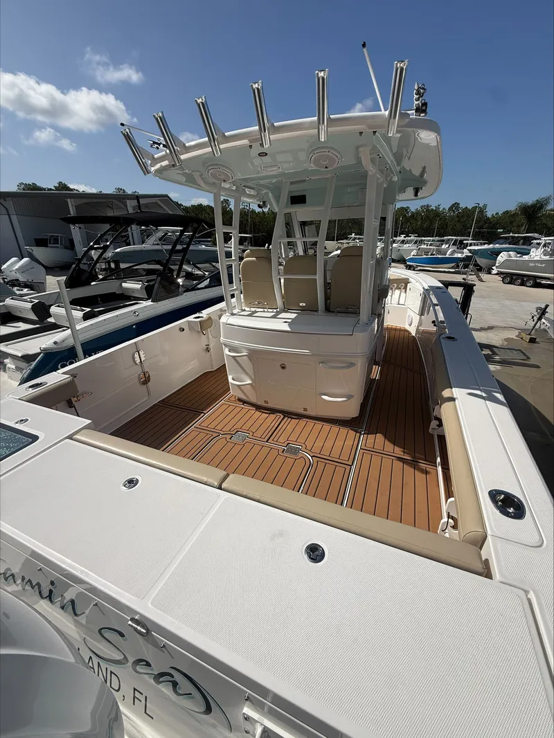 Slide: The Image of A 2020 Everglades 335 Center Console boat with a spacious deck and seating area. - 14