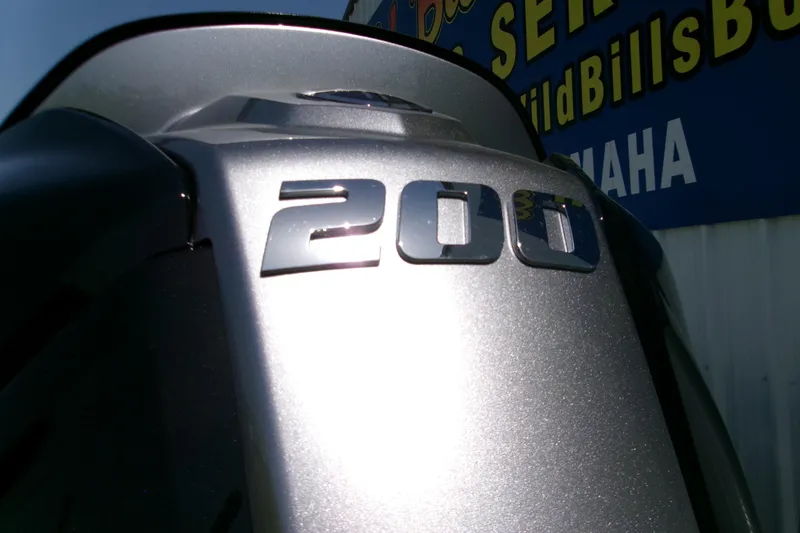 Slide: The Image of Silver outboard motor with "200" emblem, Xpress H22B Bay 2027 model. - 13