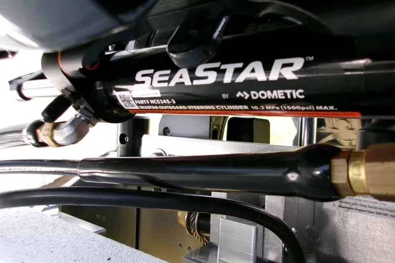 Slide: The Image of Close-up of SeaStar hydraulic steering system in 2027 Xpress H22B Bay boat. - 3