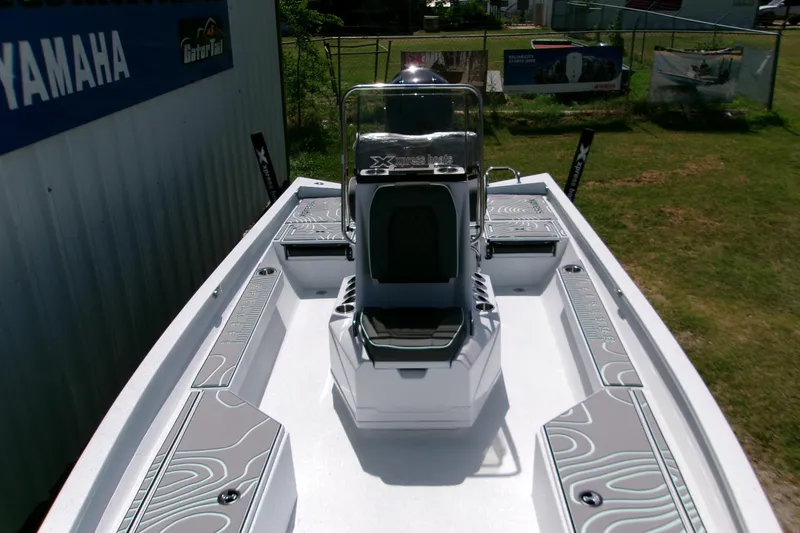 Slide: The Image of 2027 Xpress H22B Bay boat interior with sleek design and modern seating. - 22