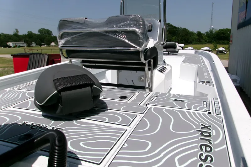 Slide: The Image of 2027 Xpress H22B Bay boat with sleek deck design and modern seating. - 14