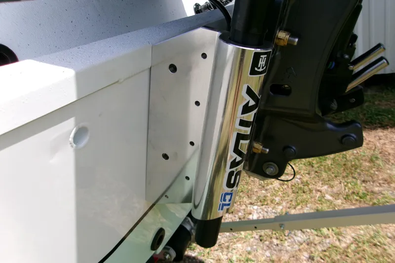 Slide: The Image of Close-up of 2027 Xpress H22B Bay boat's Atlas hydraulic jack plate. - 15
