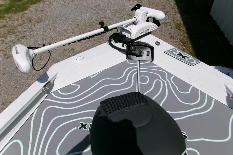 Slide: The Image of 2027 Xpress H22B Bay boat with Minn Kota trolling motor on deck. - 4