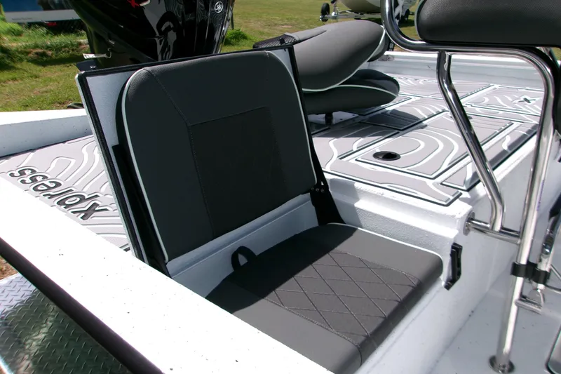 Slide: The Image of 2027 Xpress H22B Bay boat interior with cushioned seating and sleek design. - 10