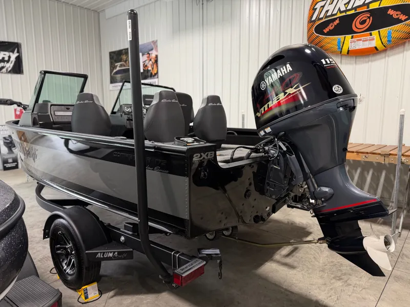 Slide: The Image of Alumacraft Competitor Shadow 175 Sport 2023 in a garage with Yamaha outboard motor. - 6