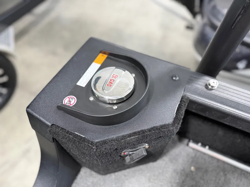 Slide: The Image of Close-up of the fuel cap on an Alumacraft Competitor Shadow 175 Sport boat. - 23