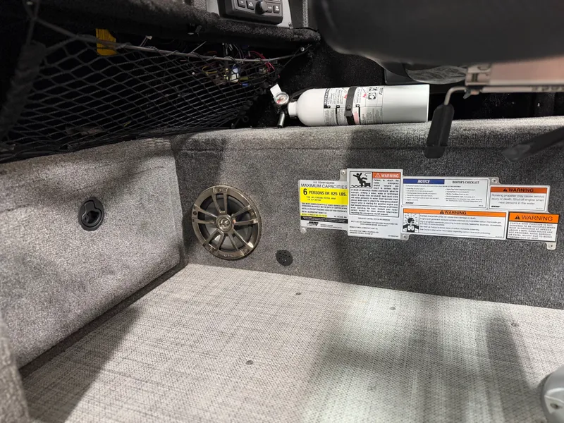 Slide: The Image of Interior of the Alumacraft Competitor Shadow 175 Sport with speaker and fire extinguisher. - 16