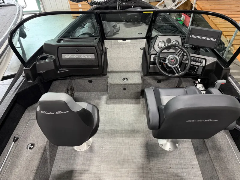 Slide: The Image of Interior view of an Alumacraft Competitor Shadow 175 Sport with two seats and a helm station. - 11