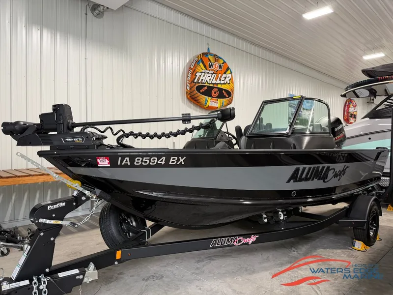 The Image of 2023 Alumacraft Competitor Shadow 175 Sport in a showroom on a trailer. - 1