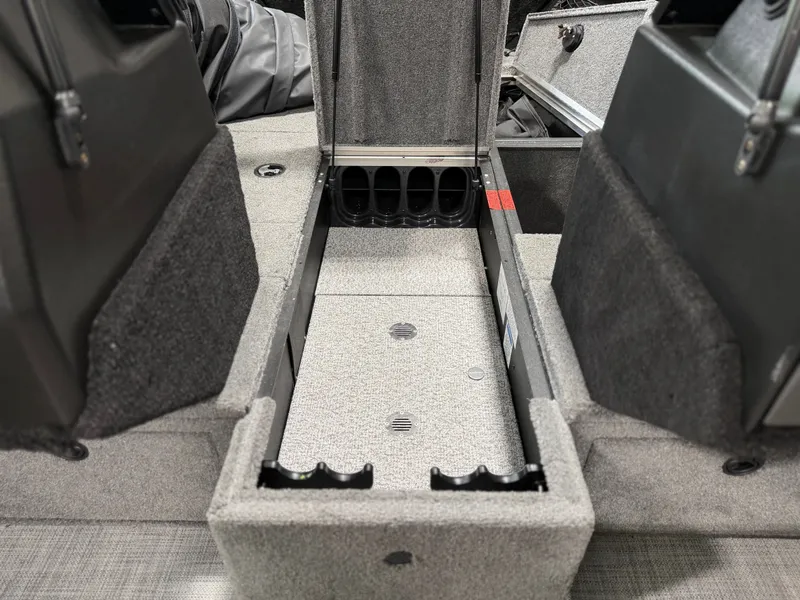 Slide: The Image of Interior view of an Alumacraft Competitor Shadow 175 Sport with storage compartment and gray carpeting. - 10