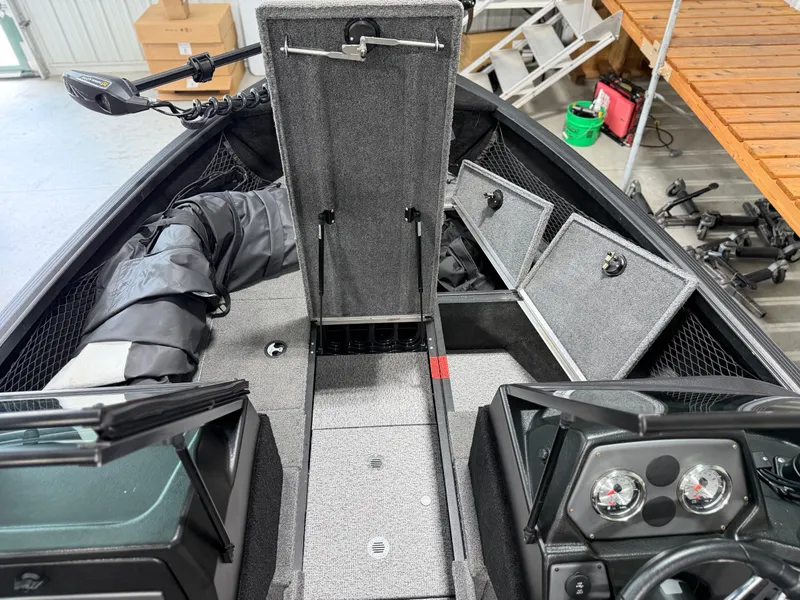 Slide: The Image of The image shows the cockpit of a 2023 Alumacraft Competitor Shadow 175 Sport boat. - 8