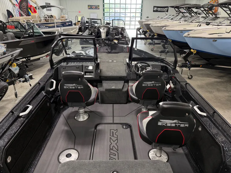 Slide: The Image of Interior view of a modern Skeeter WXR1910F boat with two seats and a steering console. - 12