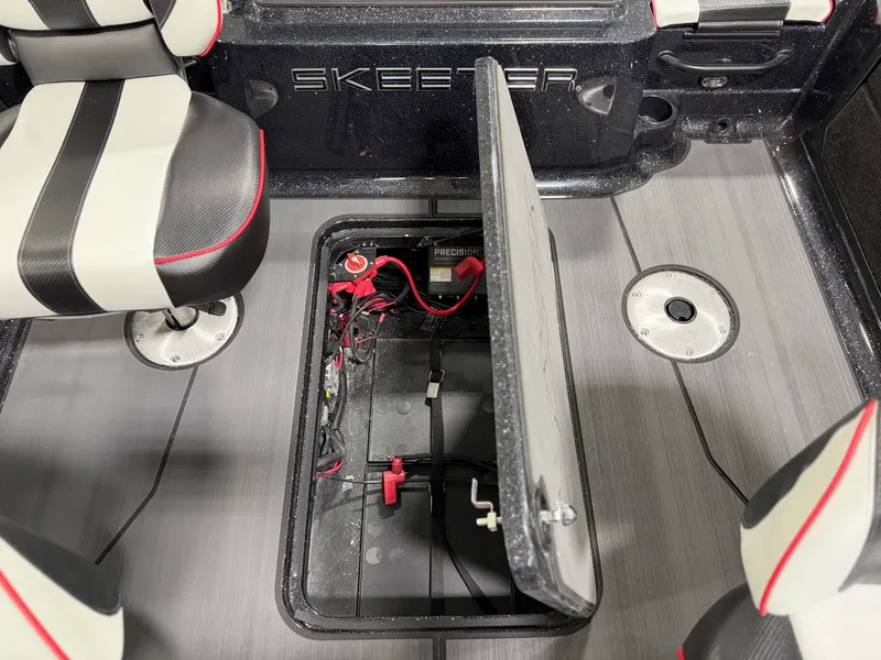 Slide: The Image of A Skeeter boat with an open floor compartment revealing batteries and wiring. - 33