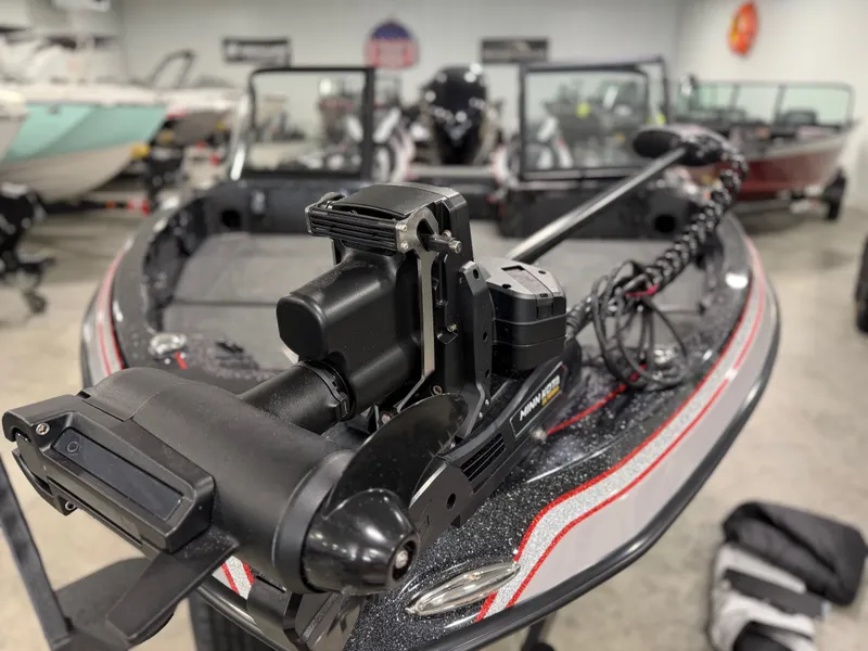 Slide: The Image of Close-up of a modern boat motor on a 2026 Skeeter WXR1910F in a showroom. - 3