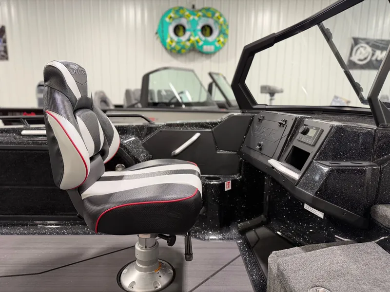 Slide: The Image of The image shows the interior of a Skeeter WXR1910F boat with a cushioned seat and dashboard. - 22