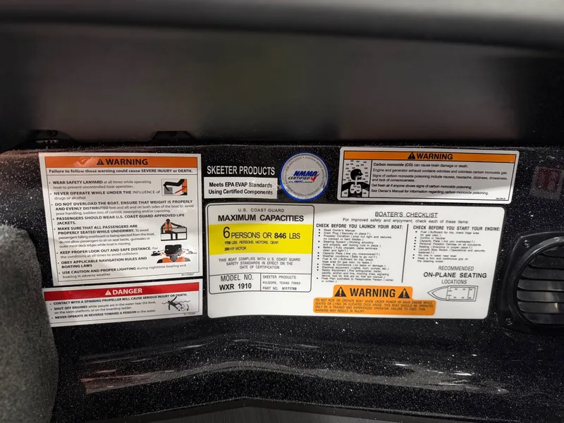 Slide: The Image of Safety and capacity labels inside a boat, including maximum persons and weight. - 26