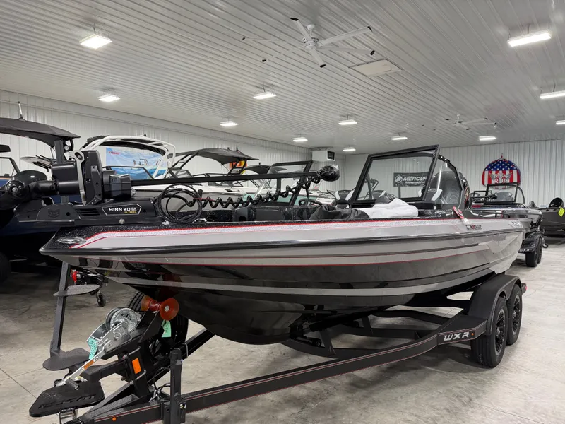 Slide: The Image of 2026 Skeeter WXR1910F in a showroom, equipped with a Minn Kota motor. - 4