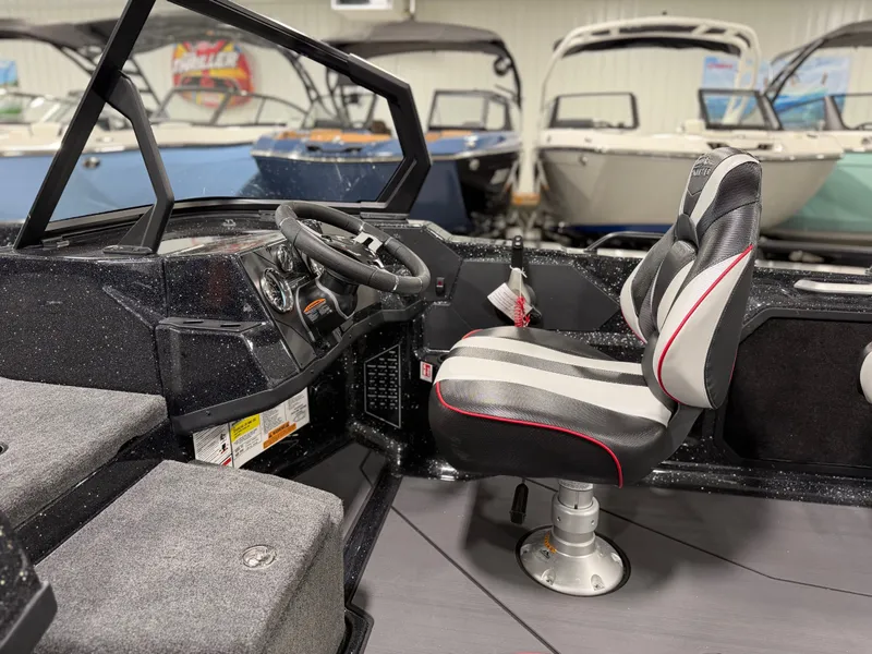 Slide: The Image of Interior view of a modern boat with a cushioned seat and a steering console. - 23
