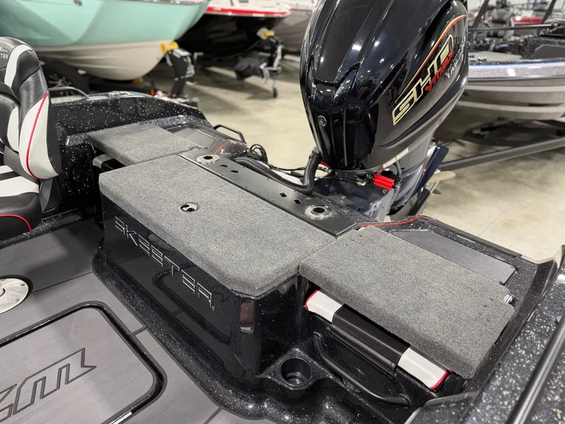 Slide: The Image of The image shows the rear of a Skeeter WXR1910F boat with an outboard motor. - 36