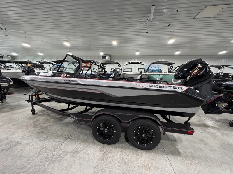 Slide: The Image of A black Skeeter WXR1910F boat from 2026 sits on a trailer in a showroom. - 7