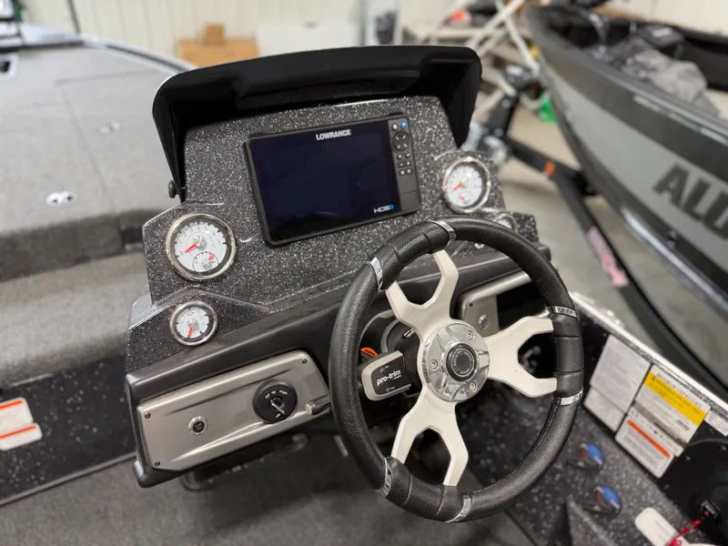 Slide: The Image of The image shows the cockpit of a Nitro Z20 Pro boat with a modern steering wheel and instruments. - 22