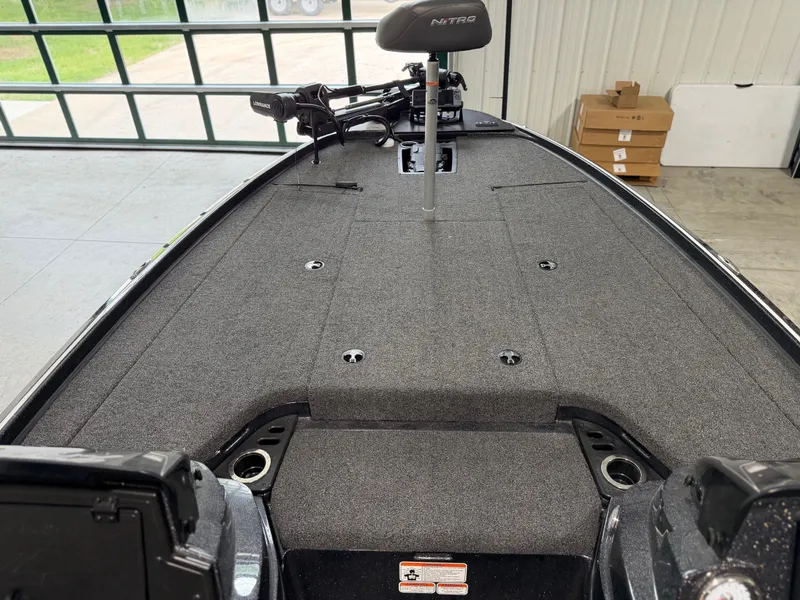 Slide: The Image of The image shows the deck of a 2024 Nitro Z20 Pro boat in a warehouse. - 8