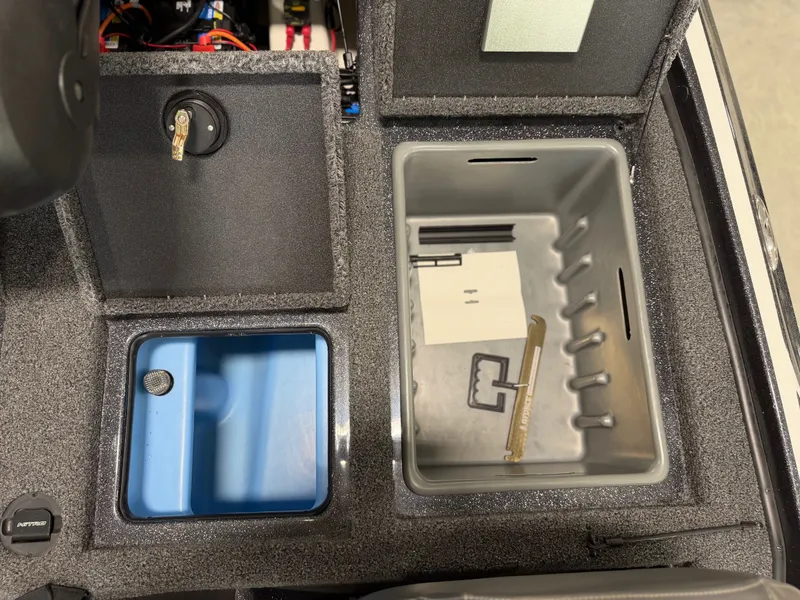 Slide: The Image of Interior view of a Nitro Z20 Pro boat with storage compartments and a blue tray. - 29