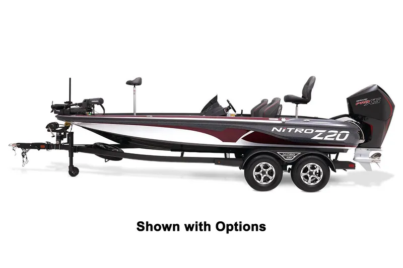 Slide: The Image of A 2024 Nitro Z20 Pro boat on a trailer, featuring a powerful outboard motor. - 40