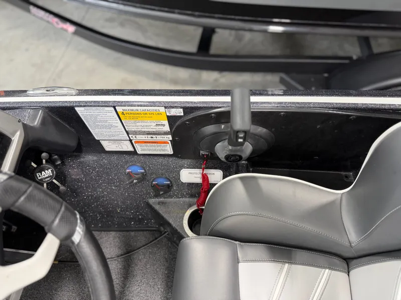 Slide: The Image of Close-up of the helm area of a Nitro Z20 Pro boat with a gray seat. - 24