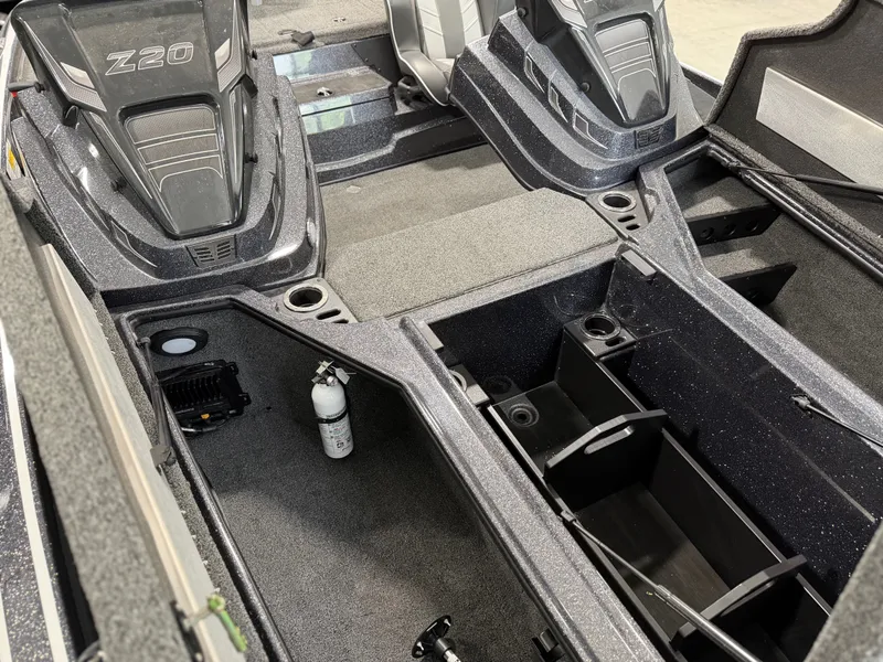 Slide: The Image of Interior view of a 2024 Nitro Z20 Pro boat with storage compartments and a fire extinguisher. - 12