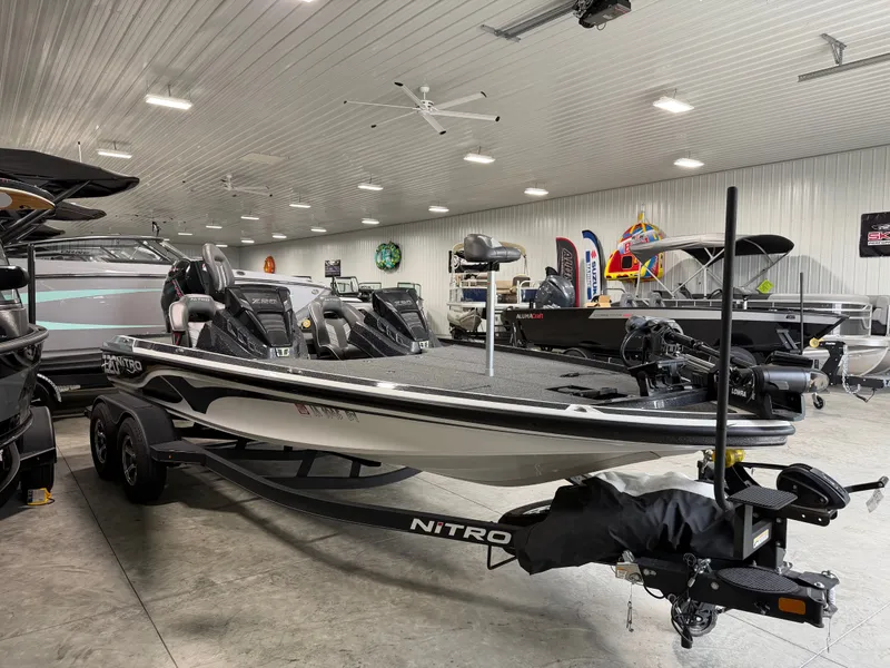 Slide: The Image of A 2024 Nitro Z20 Pro bass boat is displayed in a showroom. - 4