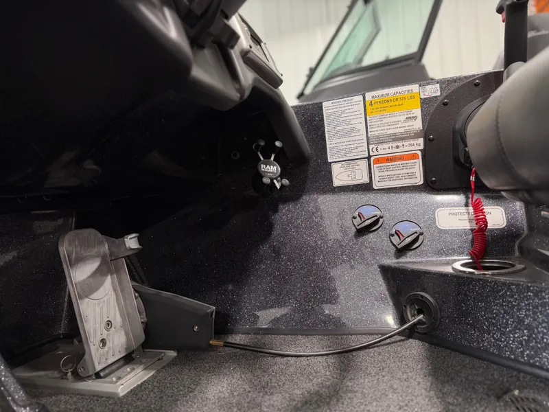 Slide: The Image of Close-up of a Nitro Z20 Pro boat cockpit with controls and gauges. - 21
