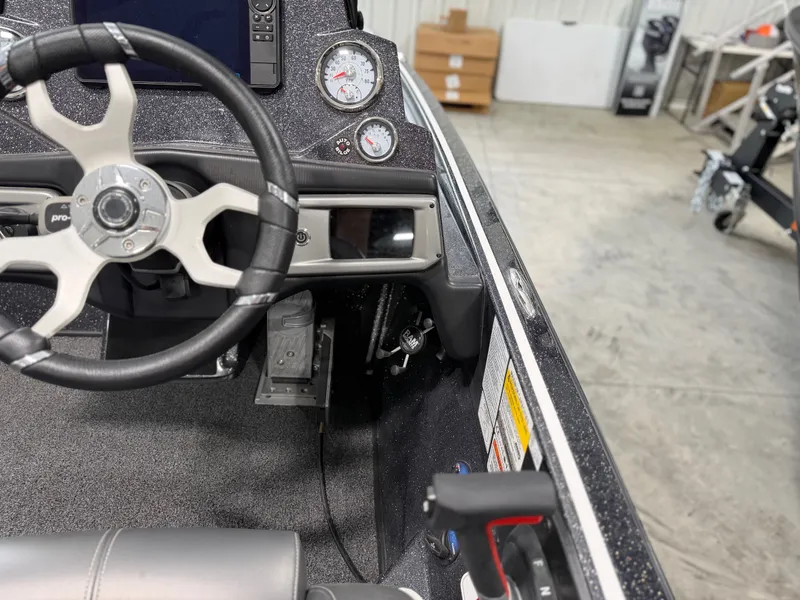 Slide: The Image of Interior view of a Nitro Z20 Pro boat with steering wheel and gauges. - 23