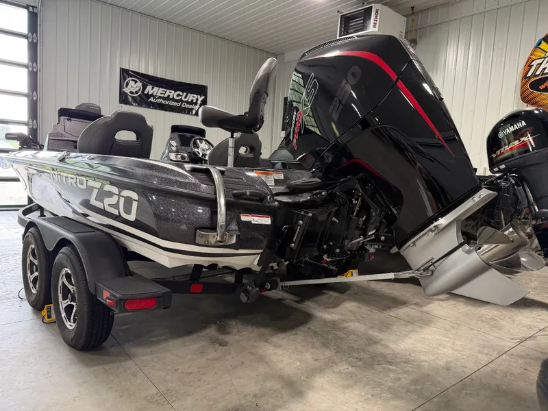 Slide: The Image of 2024 Nitro Z20 Pro in a showroom, featuring a powerful outboard motor. - 7