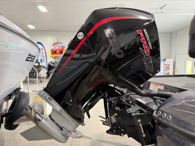 Slide: The Image of A Mercury Pro XS outboard motor is attached to a boat in a showroom setting. - 6