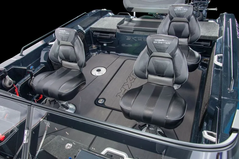 Slide: The Image of The image shows the interior of a Skeeter WXR2060 boat with three black seats. - 47