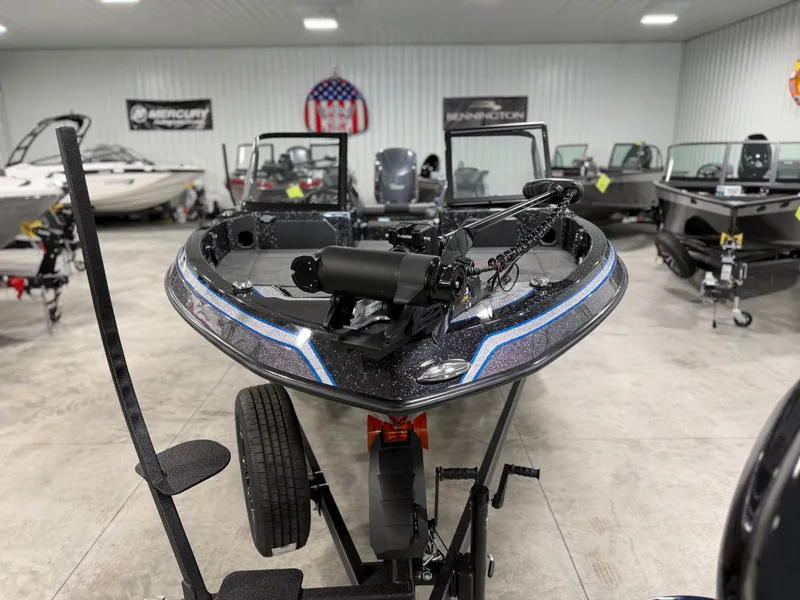 Slide: The Image of A 2026 Skeeter WXR2060 boat is on a trailer in a showroom. - 3