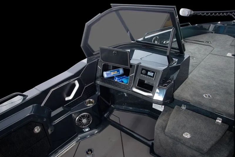 Slide: The Image of The image shows the cockpit of a Skeeter WXR2060 boat with storage and a speaker. - 46