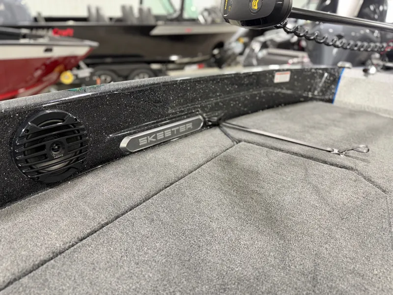 Slide: The Image of Close-up of a Skeeter WXR2060 boat interior with gray carpeting. - 11