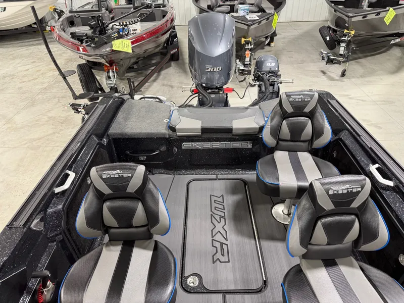 Slide: The Image of Interior view of a Skeeter WXR2060 boat with four seats and an engine. - 27