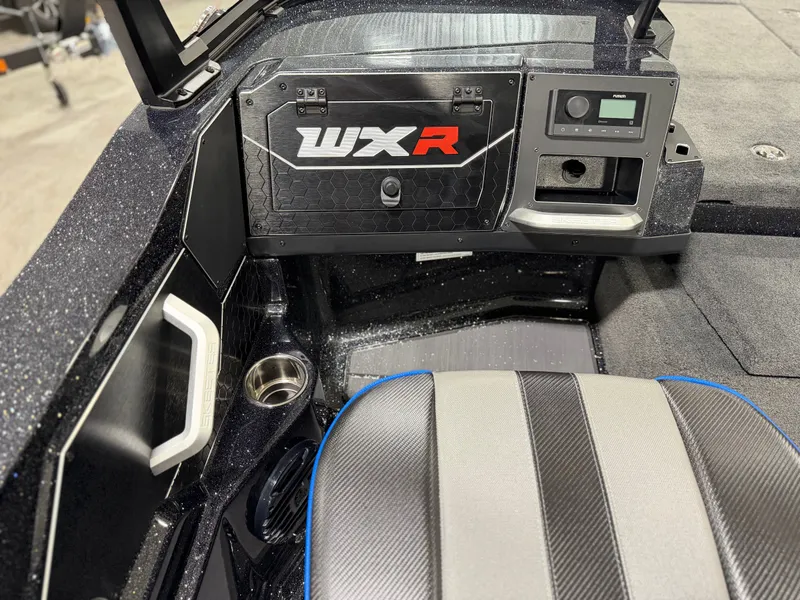 Slide: The Image of The image shows the cockpit of a Skeeter WXR2060 boat with modern controls and a padded seat. - 17