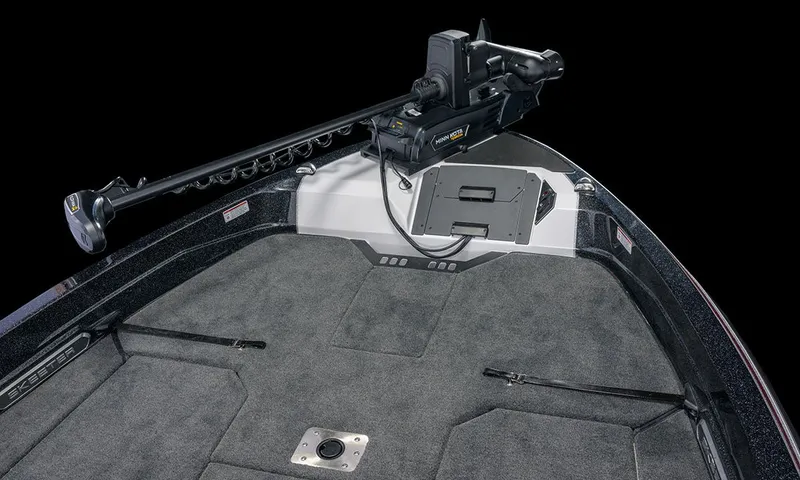 Slide: The Image of The image shows the bow deck of a Skeeter WXR2060 boat with gray carpeting and a mounted motor. - 44