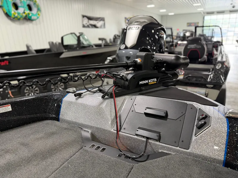 Slide: The Image of The image shows the deck of a Skeeter WXR2060 boat with a Minn Kota trolling motor. - 10