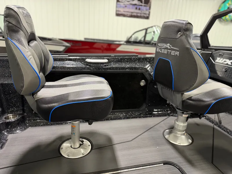 Slide: The Image of Two cushioned boat seats with blue accents in a modern boat interior. - 19